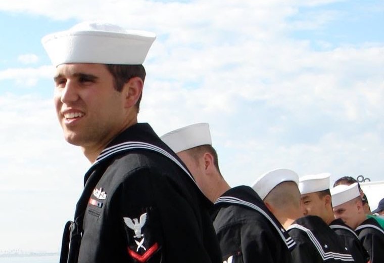 Greg Quinn in U.S. Navy dress blues aboard the USS Chancellorsville